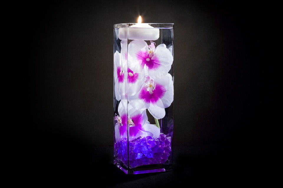 Violet Floral Centerpiece with Decorative Gems and Floating Candles