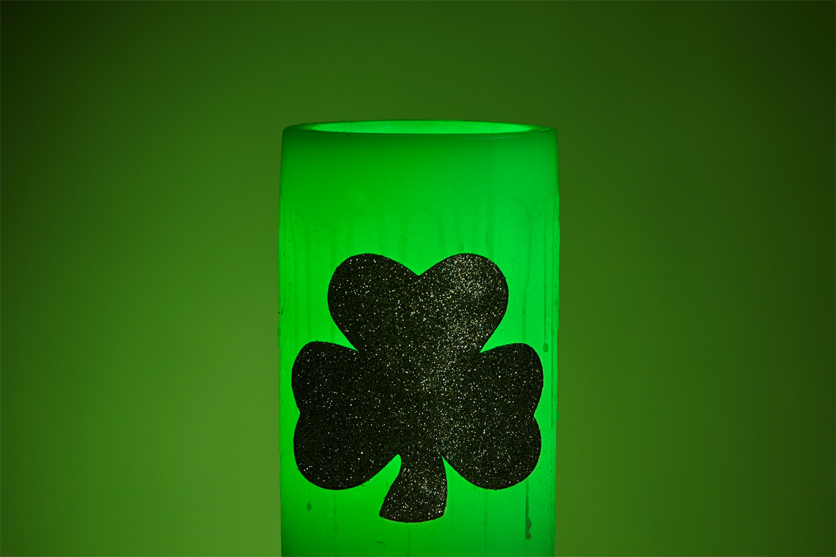 Hollow Wax Luminary Illuminated Green with a Lucky 4 Leaf Clover