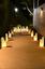 TOI Event Path Entrance Illuminated with Large Wax Luminaries