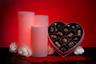 Red Valentines Day Flameless Candles with a Box of Chocolates