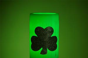 Hollow Wax Luminary Illuminated Green with a Lucky 4 Leaf Clover