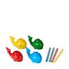 Four Birthday Candles In Whale Shaped Colored Holders